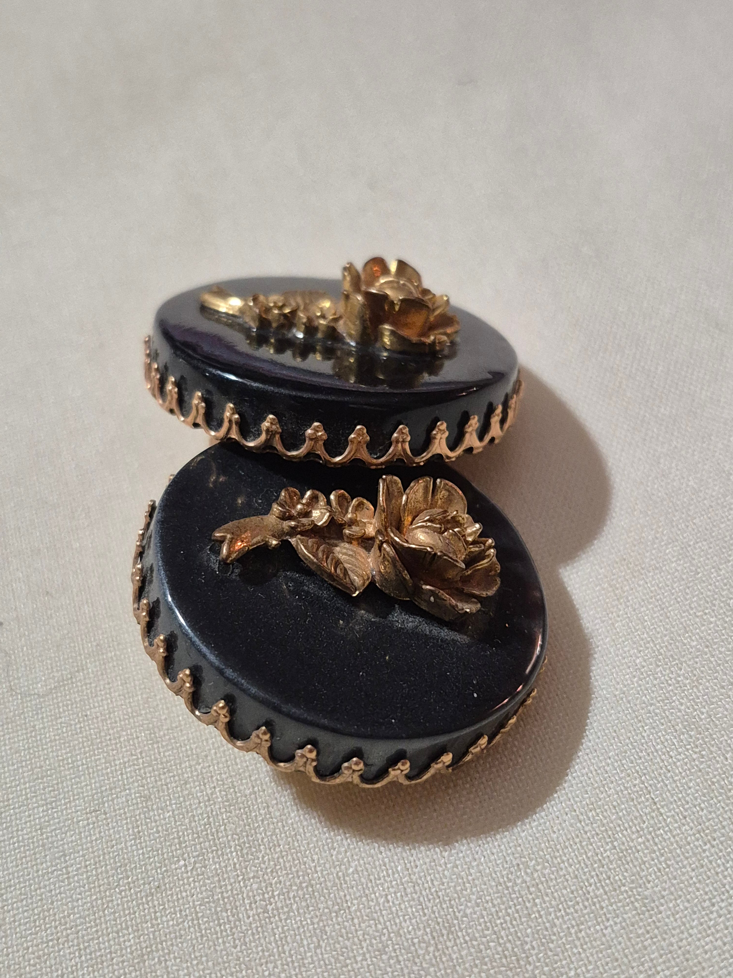 Large, 3-D rose earrings.