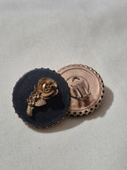 Large, 3-D rose earrings.