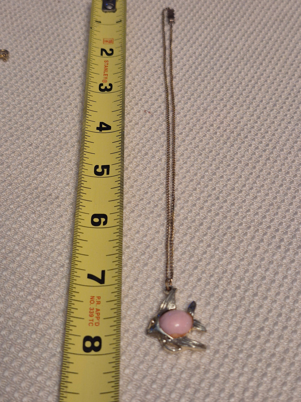 Pink and gold fish necklace
