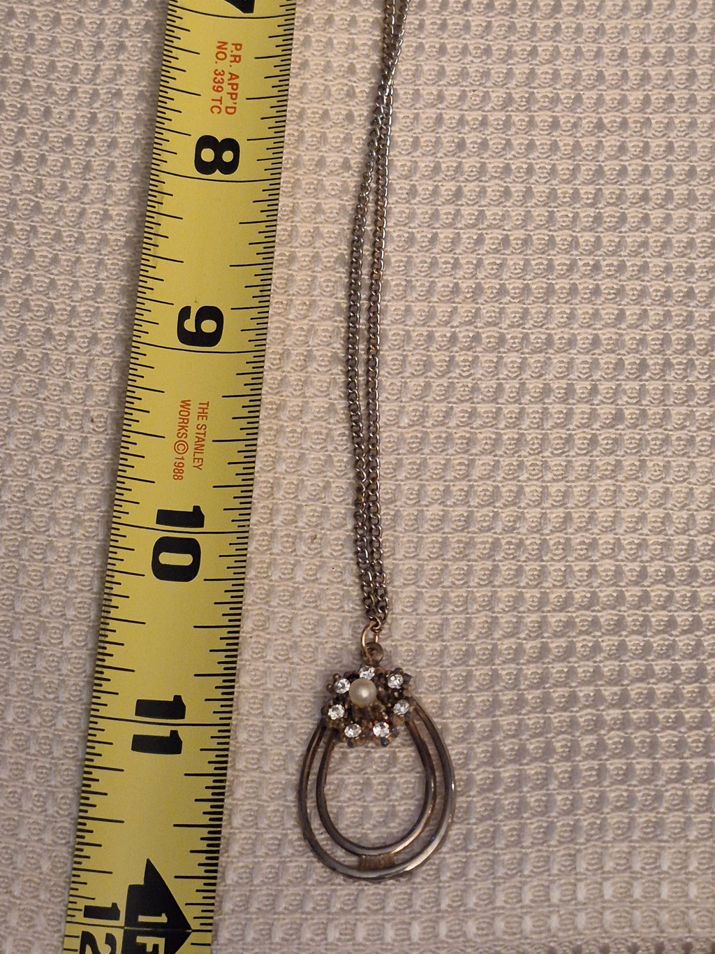 Gold-tone and diamond necklace